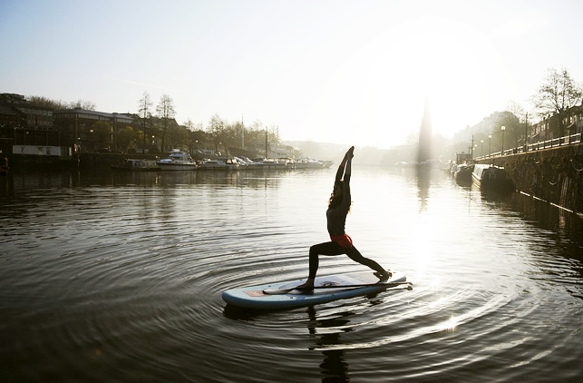 Trying beginner Stand Up Paddle board Yoga 